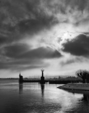 View across Lake Constance to the port of Constance with harbor entrance and the Imperia statue, on