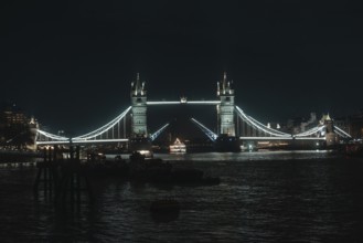 Iconic Tower Bridge, elegantly lit over water, London, England, Great Britain