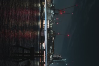 Nocturnal scene with illuminated river and bridge in the background, London, England, Great Britain