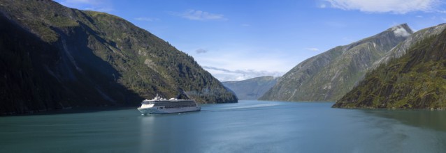 Cruise to Alaska, cruise ship sailing through scenic landscapes, mountains and lakes