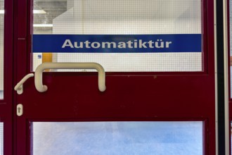 Automatic door on door inscription with safety glass, Germany