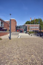 Town hall, brick building, modern architecture, entrance, staircase, lantern, flagpoles, flag,