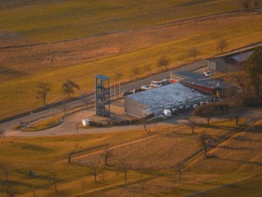 Close-up of fire station with chimney and snow-covered roof in the middle of fields, Althengstett,