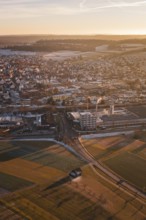 Overview of a town with fields and vast landscapes at sunset, Althengstett, Calw district, Germany