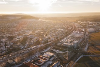 Sunset over a town with fields and industrial complexes in the foreground, Althengstett, Calw