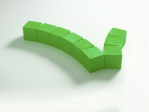9 green wooden cubes against a white background