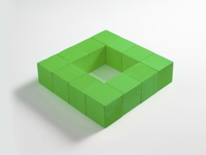 12 green wooden cubes against a white background