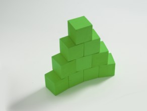 10 green wooden cubes against a white background