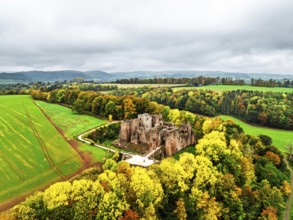 Autumn Colours over ruins of Goodrich Castle and River Wye from a drone, Goodrich, Herefordshire,