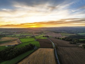 Sunset of Devon Farms and Fields over Berry Pomeroy from a drone, Totnes, England, United Kingdom
