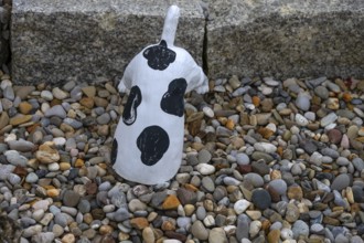 Dog figure with head in a stone bed, Franconia, Bavaria, Germany