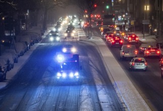 Ambulance, RTW, the Essen professional fire brigade during an emergency trip with flashing lights,