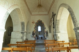 Painted church St Aignan's Church of Begues. Central nave flanked by two aisles. Allier department.