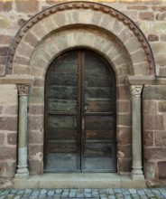 Azerat village. Porch of Roman church Saint-Jean-Baptiste . Haute Loire. Auvergne Rhone Alpes.