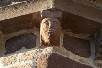 Azerat village. Sculpture of Roman church Saint-Jean-Baptiste . Haute Loire. Auvergne Rhone Alpes.