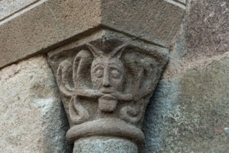 Sculptural details on the porch of the Romanesque church in Azerat village, Haute Loire,