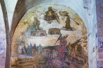 Issoire. Pillar (The Annunciation made to Mary) . The figures are illuminated by colorful light