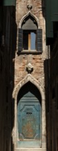 Old entrance gate at the end of Calle Mezzo, Sestiere Castello, Venice, Veneto, Italy