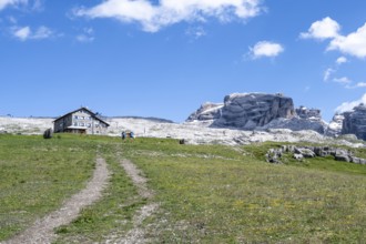 Hikers in front of Rifugio Graffer, Brenta, Brenta-Adamello Natural Park, Trentino, Italy