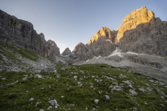 Picturesque mountain landscape in Val Brenta Alta at sunrise, rocky peaks of Cima Tosa,