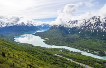 View of snowy mountains in spring and turquoise blue Kenai Lake, Slaughter Ridge Trail, Cooper