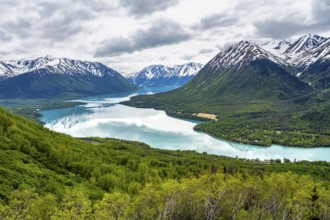 View of snowy mountains in spring and turquoise blue Kenai Lake, Slaughter Ridge Trail, Cooper