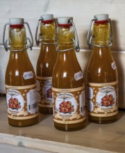 Swedish souvenir: cloudberry juice in a bottle in Smålandet Moose park in Markaryd, Småland County,