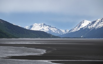 View of the Turnagain Arm estuary at low tide to the mountains of the Kenai Peninsula, Anchorage,
