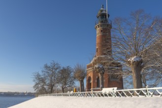 Holtenau lighthouse at the entrance of the Kiel Canal in winter, west bank of the Kiel Fjord,
