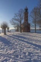 Holtenau lighthouse at the entrance of the Kiel Canal in winter, west bank of the Kiel Fjord,