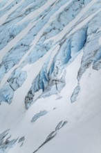 Blue rugged glacier ice with crevasses and snow, detail, Exit Glacier, Kenai Peninsula, Alaska, USA