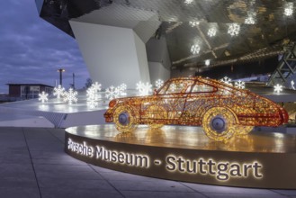 Highlights on Porscheplatz in Zuffenhausen. In front of the Porsche Museum and the car