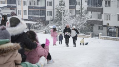 In Gaziantep, Turkey, on December 31, 2025, children and families enjoy winter activities as they