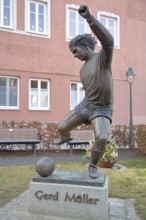 Memorial to soccer player Gerd Müller, German national team player, soccer legend, bronze