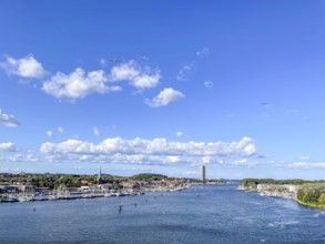 View over the Trave towards the mouth in the underground, the church of Travemünde and the Atlantic