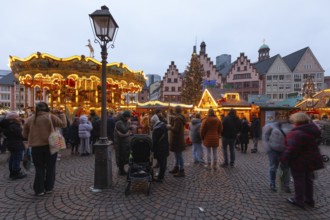 December 22, 2025, Frankfurt Christmas Market on Roemerberg with the skyline in the background at