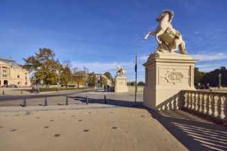 Castle bridge, entrance portal, horse sculpture, car bridge and footbridge, sidewalk, sandstone