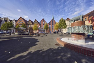 Pastor sin Kauh fountain, bronze sculpture, sculptor Stephan Horota, historic half-timbered houses,