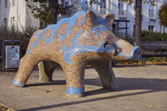 Sculpture of a wild boar, tiles, designer Franz-Ulrich Poppe, public trash can, trees, general