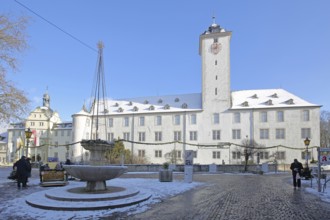 Deutschordenschloss with wind tower and bowl fountain in winter with snow, Deutschordenplatz, Bad