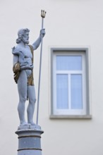 Fountain and Neptune with trident sculpture, Roman water god, Neptune fountain, market square,