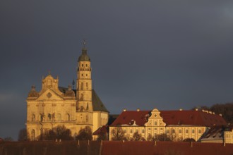Benedictine monastery with late baroque monastery church, lighting atmosphere, winter, Neresheim,