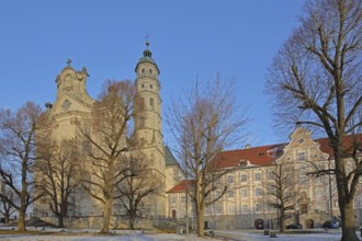 Late Baroque monastery church in winter with snow, courtyard, Benedictine monastery, Neresheim,
