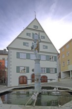 Amtshaus with fountain and Neptune sculpture, Roman water god, historic half-timbered house,