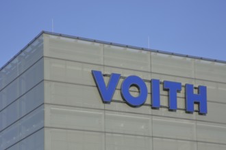 Voith company emblem with blue inscription, company, industry, steel production, mechanical