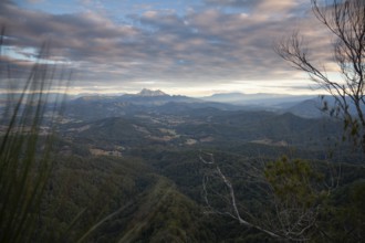 Sunset with an open view across the valley toward Mount Warning (Wollumbin), captured from the