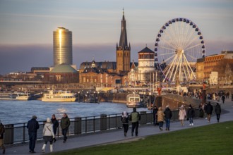 Rhine promenade in Düsseldorf, Ferris wheel, old castle tower, St. Lambert Basilica, old town, ERGO