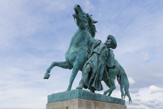 Buda Castle, Statue of the Horseherd taming a wild horse in front of the Riding Hall, Budapest,