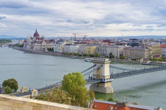 Hungarian parliament along the Danube River and Chain Bridge, Budapest, Hungary