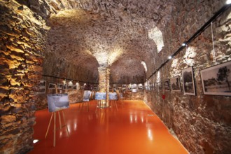 Exhibition at the Porto tourist office, a former Genoese weapons warehouse, interior view, Ota,